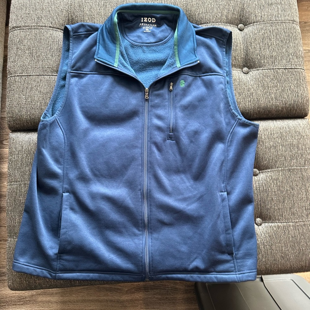 Men’s Izod vest. Size XXL. Color blue with green trim.